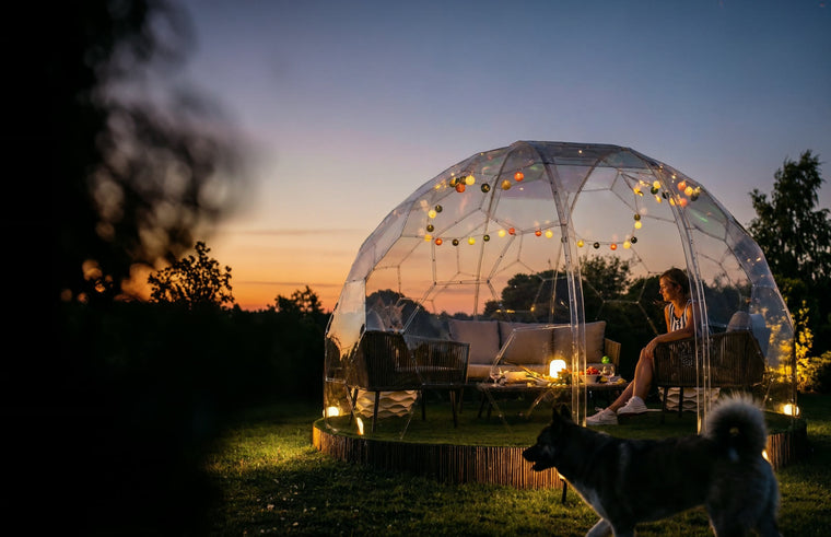 A GeoDomeX glowing warm at dusk